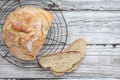 Fresh Artisanal Bread Cooling on Bakers Rack Royalty Free Stock Photo