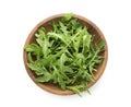 Fresh arugula leaves in bowl isolated on white, top view Royalty Free Stock Photo
