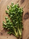 Fresh arugula leaves on a wooden background. Top view.