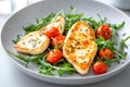 Fresh arugula salad with grilled halloumi and cherry tomatoes on a light textured background Royalty Free Stock Photo
