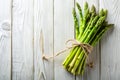 Fresh Asparagus Bunch on Rustic White Wood A Minimalist Spring Vegetable Display for a Healthy and Elegant Table Royalty Free Stock Photo