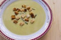 Fresh asparagus cream soup on wooden background overhead shoot. Royalty Free Stock Photo