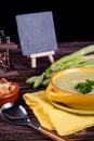 Fresh asparagus creamy soup and ingredients on a wooden table. Royalty Free Stock Photo