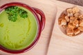 Fresh asparagus creamy soup and ingredients on a wooden table. Royalty Free Stock Photo