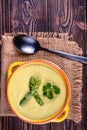 Fresh asparagus creamy soup and ingredients on a wooden table. Royalty Free Stock Photo