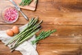 Fresh asparagus eggs and french dressing ingredients with dijon mustard, onion chopped in red vinegar  taragon on light wooden old Royalty Free Stock Photo