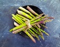 fresh asparagus plate on a dark concrete background Royalty Free Stock Photo