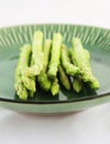 Fresh asparagus shoots on a plate Royalty Free Stock Photo