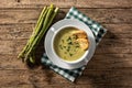 Fresh asparagus soup on wooden table Royalty Free Stock Photo