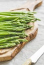 Fresh asparagus on a wooden cutting board. Royalty Free Stock Photo