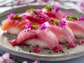 Fresh Assorted Sushi Plate with Salmon, Tuna, and Hamachi Garnished with Edible Flowers and Herbs