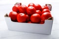 Fresh assorted tomatoes in cardboard boxes on white background