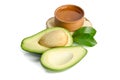 Fresh avocado with avocado oil in the wooden bowl