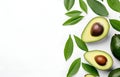 fresh avocado fruit with leaves on white wooden table for healthy life eating and diet card design