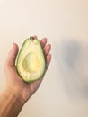 Avocado in the hand Royalty Free Stock Photo