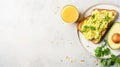 Fresh avocado toast with scrambled eggs and juice, perfect for a healthy breakfast Royalty Free Stock Photo
