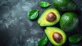 Avocados With Leaves and Water Droplets on a Dark Background. Generative AI Royalty Free Stock Photo