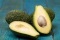 Fresh avocados on wooden background.