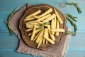 Fresh baby corn cobs on blue wooden table, flat lay Royalty Free Stock Photo