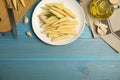 Fresh baby corn cobs on blue wooden table, flat lay. Space for text Royalty Free Stock Photo