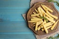 Fresh baby corn cobs on wooden table, flat lay. Space for text Royalty Free Stock Photo