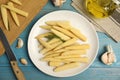 Fresh baby corn cobs on blue wooden table, flat lay Royalty Free Stock Photo