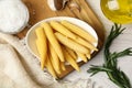 Fresh baby corn cobs and spices on white wooden table, flat lay Royalty Free Stock Photo
