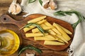 Fresh baby corn cobs on wooden table, flat lay Royalty Free Stock Photo