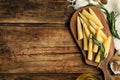 Fresh baby corn cobs on wooden table, flat lay. Space for text Royalty Free Stock Photo