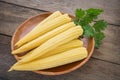 Fresh baby corn on wooden plate Royalty Free Stock Photo
