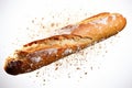 Fresh baguette bread with crumbs falling, isolated on white background for bakery concept Royalty Free Stock Photo