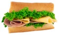 Fresh baguette sandwich with ham, cheese, tomatoes, and lettuce Royalty Free Stock Photo