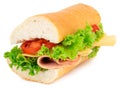 Fresh baguette sandwich with ham, cheese, tomatoes, and lettuce Royalty Free Stock Photo