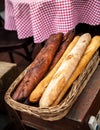 Fresh baguettes bread in a basket. Many baguettes