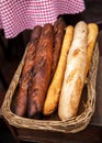 Fresh baguettes bread in a basket. Many baguettes