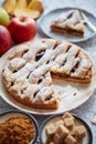 Fresh baked apple pie with cutted slice on small plate Royalty Free Stock Photo