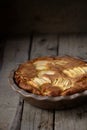 Fresh baked Apple Rum Pie on a Wooden Table