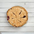 Fresh Baked Blackberry Pie that is Homemade and Messy on White or Gray Shiplap Board Background Table with a Square Crop and an ab