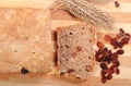 Fresh baked bread, ears of wheat and raisins