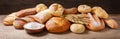 Fresh baked bread, flour and wheat ears on wooden table Royalty Free Stock Photo