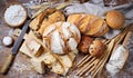 Assorted traditional bread with loaves, rolls and breadsticks on a wooden worktop, top view. Royalty Free Stock Photo