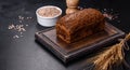 Fresh baked brown bread with ears and grains of wheat Royalty Free Stock Photo