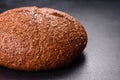 Fresh baked brown bread with ears and grains of wheat Royalty Free Stock Photo