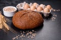 Fresh baked brown bread with ears and grains of wheat Royalty Free Stock Photo