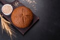 Fresh baked brown bread with ears and grains of wheat Royalty Free Stock Photo