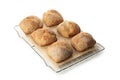 Fresh baked buns on cooling rack isolated on white background Royalty Free Stock Photo