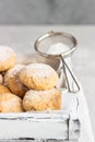 Fresh baked butter cookies with peanut sprinkled with powdered sugar. Light grey stone background. Royalty Free Stock Photo