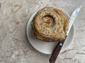 Fresh-baked cardamom roll for breakfast at a cafe.