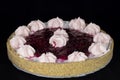 Fresh baked cherry pie with whipped cream decorations on top Royalty Free Stock Photo