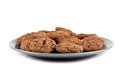 Fresh baked chocolate chip cookies heap on grey plate isolated on white